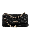 A black quilted leather shoulder bag by GUESS, featuring a gold-tone chain strap and a gold 'GUESS EST.1981' logo on the front, set against a plain white background.