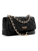 A black quilted leather crossbody bag by GUESS, featuring a gold-tone chain strap and a gold 'GUESS EST.1994' logo on the front flap, set against a plain white background.