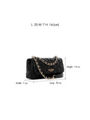Black quilted GUESS handbag with a gold chain strap, shown with dimension lines and text indicating measurements: 25 cm width, 7 cm height, and 14 cm length.