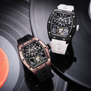 Two Richard Mille wristwatches displayed on black vinyl records. One watch has a black case and black strap, while the other has a rose gold-toned case and a white strap.