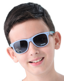 Child wearing blue Batman sunglasses against a light blue background