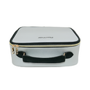 Silver cosmetic case with black handle and trim on a white background