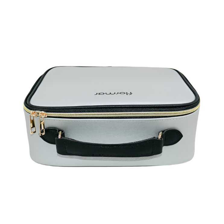 Silver cosmetic case with black handle and trim on a white background